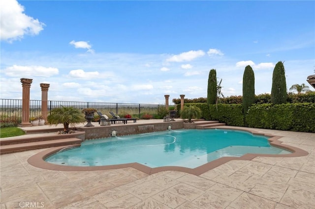 view of swimming pool featuring fence, a fenced in pool, and a patio area