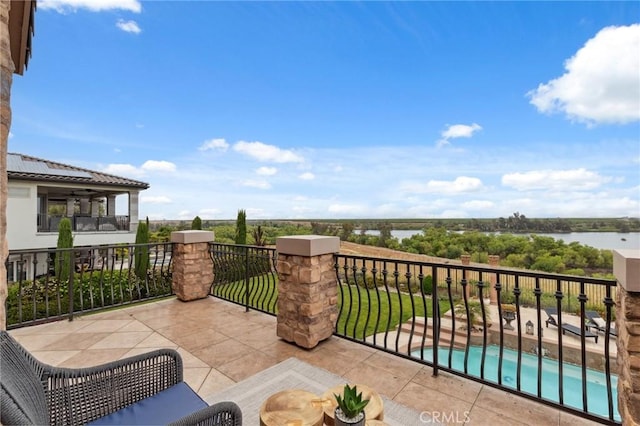 balcony featuring a water view