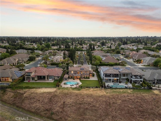 birds eye view of property with a residential view