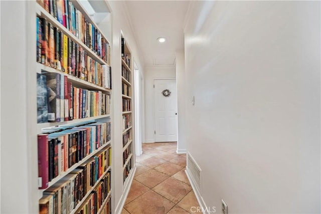 corridor featuring visible vents, crown molding, light tile patterned floors, baseboards, and recessed lighting