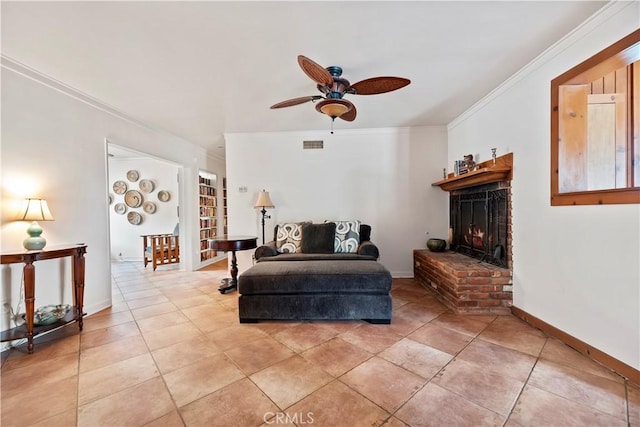 living room featuring visible vents, crown molding, a fireplace, a ceiling fan, and light tile patterned floors