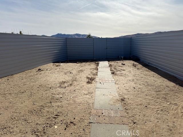 8620 Pearblossom, Littlerock, CA 93543 - view of yard with fence and a gate