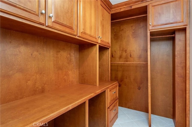 mudroom with light tile patterned floors