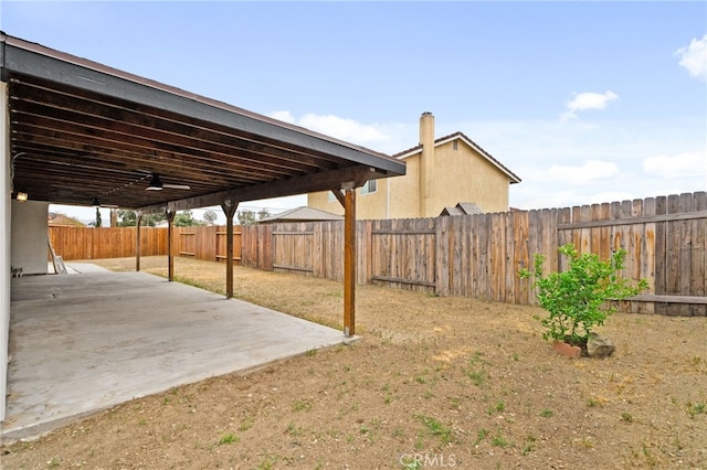 view of yard with a patio and a fenced backyard