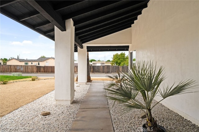 view of patio / terrace featuring fence