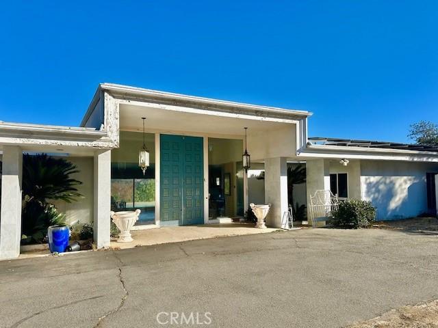 view of front of home featuring stucco siding