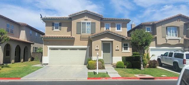 822 Belleza Dr, Oxnard, CA 93030 - mediterranean / spanish-style home with a garage, concrete driveway, stucco siding, a tile roof, and a front yard