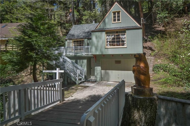 230 Fremont Rd, Lake Arrowhead, CA 92352 - rear view of house featuring stairway, a wooden deck, and roof with shingles