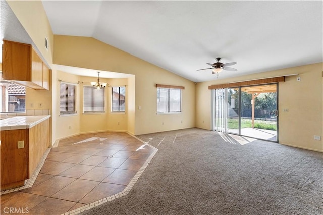 15631 Via Cartagena St, Hesperia, CA 92345 - unfurnished living room with baseboards, light tile patterned floors, ceiling fan with notable chandelier, and lofted ceiling