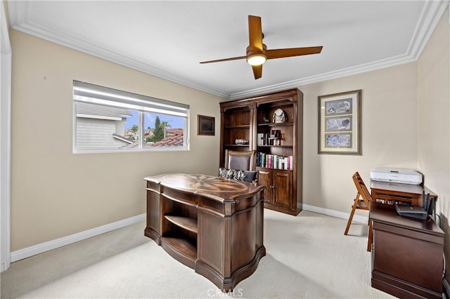 home office with crown molding, a ceiling fan, baseboards, and light carpet