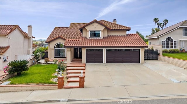 mediterranean / spanish-style house with fence, stucco siding, a chimney, a tiled roof, and concrete driveway