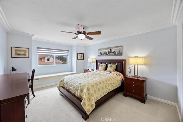 bedroom with baseboards, ornamental molding, a ceiling fan, and light carpet
