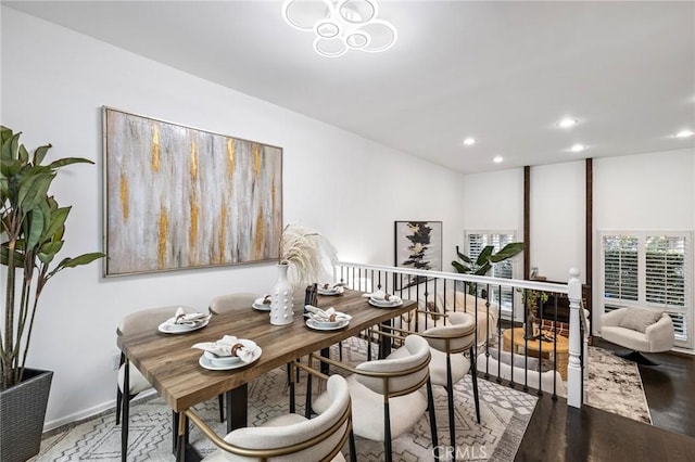 dining room with recessed lighting and wood finished floors
