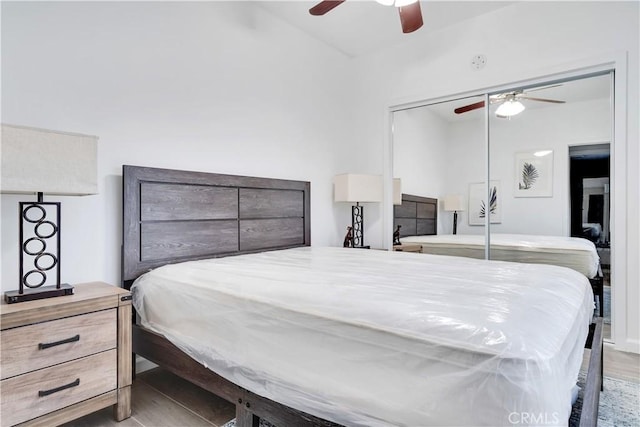bedroom with wood finished floors, ceiling fan, and vaulted ceiling