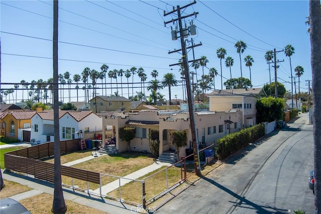exterior space featuring fence and a residential view