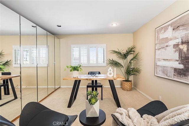 office space featuring baseboards, recessed lighting, carpet flooring, and plenty of natural light