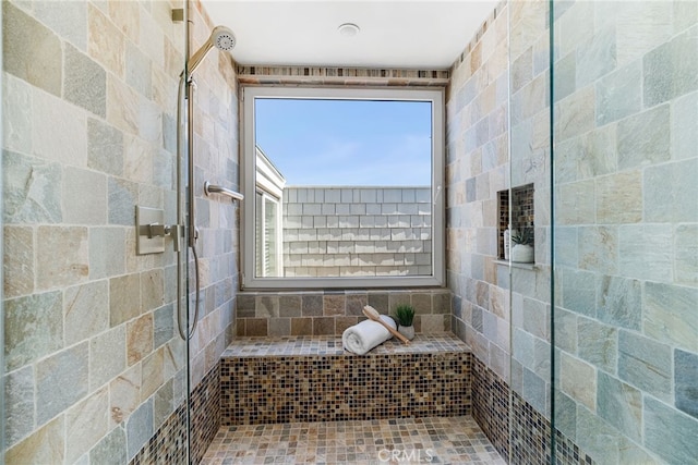 full bathroom featuring tiled shower