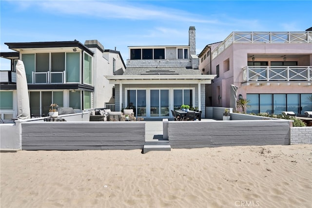 back of property with outdoor lounge area