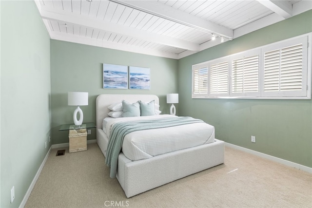 bedroom with wood ceiling, visible vents, baseboards, beam ceiling, and carpet
