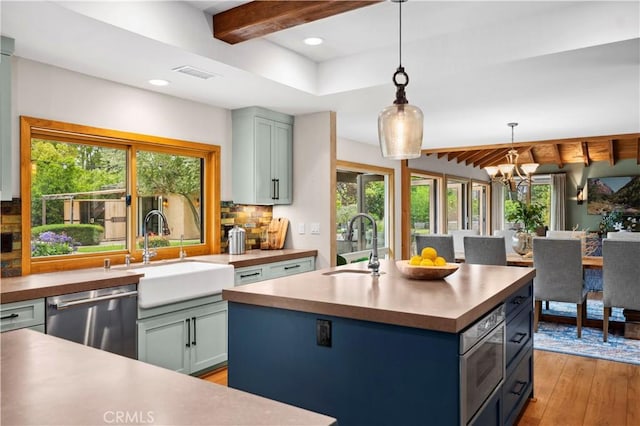 2291 Pavillion Dr, North Tustin, CA 92705 - kitchen featuring a sink, stainless steel appliances, plenty of natural light, and visible vents