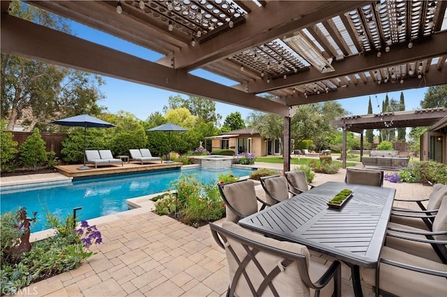 2291 Pavillion Dr, North Tustin, CA 92705 - view of swimming pool with outdoor dining area, fence, a pool with connected hot tub, a patio area, and a pergola