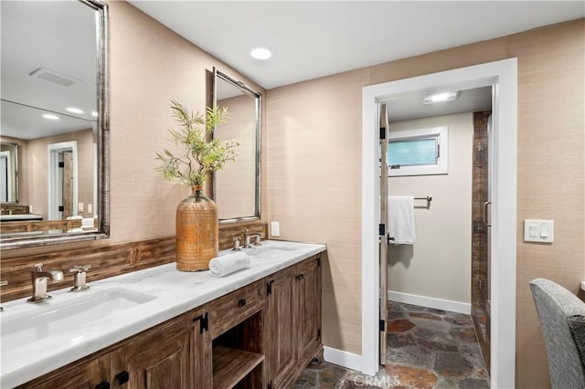 2291 Pavillion Dr, North Tustin, CA 92705 - bathroom featuring double vanity, a sink, stone finish floor, visible vents, and backsplash