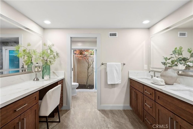 2291 Pavillion Dr, North Tustin, CA 92705 - full bathroom with a sink, toilet, visible vents, a stall shower, and double vanity