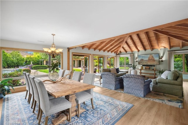 2291 Pavillion Dr, North Tustin, CA 92705 - dining space with a notable chandelier, lofted ceiling with beams, and wood finished floors