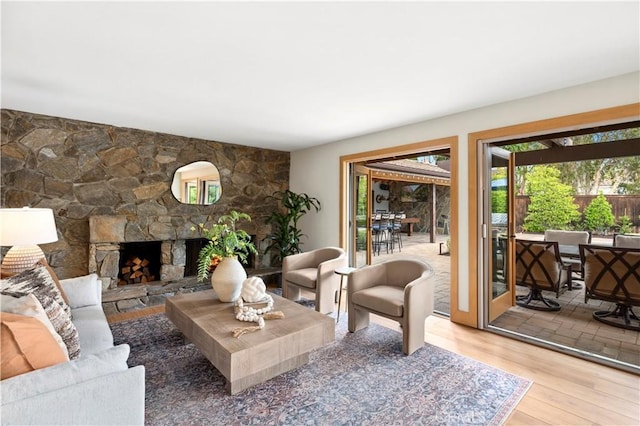 2291 Pavillion Dr, North Tustin, CA 92705 - living area featuring a stone fireplace and light wood-style floors