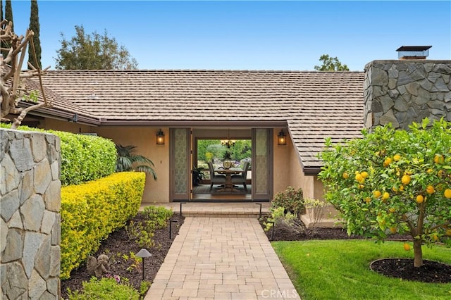 2291 Pavillion Dr, North Tustin, CA 92705 - property entrance featuring stucco siding and a chimney
