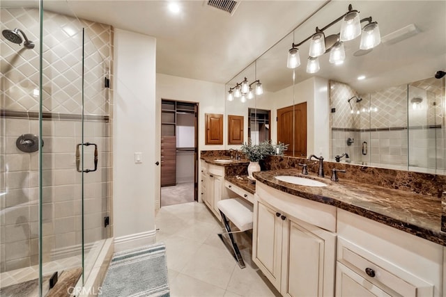 4301/2 Heliotrope Ave, Corona Del Mar, CA 92625 - bathroom featuring vanity, a stall shower, tile patterned flooring, and a closet
