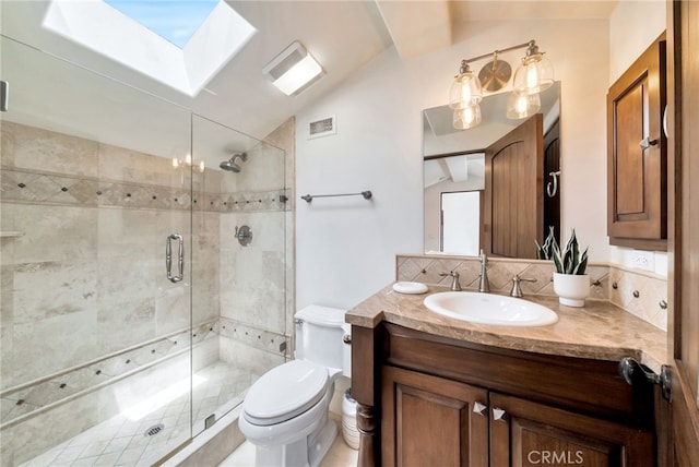 4301/2 Heliotrope Ave, Corona Del Mar, CA 92625 - bathroom with vaulted ceiling with skylight, vanity, toilet, visible vents, and a stall shower