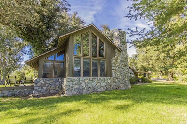 28831 Spruce Rd, Pine Valley, CA 91962 - rear view of house featuring stone siding, a chimney, and a yard