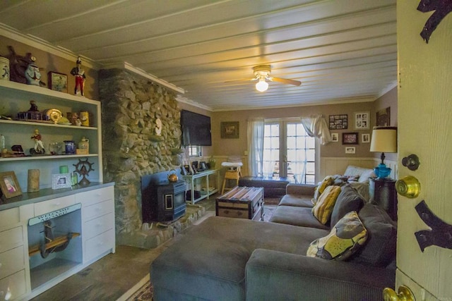 28831 Spruce Rd, Pine Valley, CA 91962 - living room with a wood stove, crown molding, a ceiling fan, wainscoting, and french doors