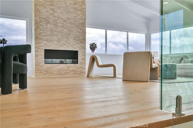 8 Clipper Rd, Rancho Palos Verdes, CA 90275 - interior space with beamed ceiling, high vaulted ceiling, a stone fireplace, wood ceiling, and wood finished floors
