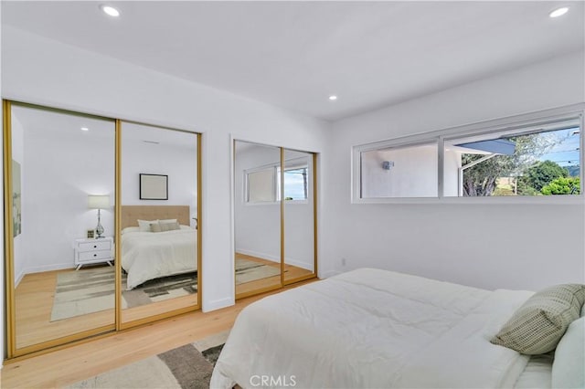 8 Clipper Rd, Rancho Palos Verdes, CA 90275 - bedroom with recessed lighting, two closets, wood finished floors, and multiple windows