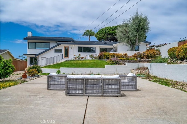8 Clipper Rd, Rancho Palos Verdes, CA 90275 - rear view of house with fence, a patio area, a yard, and outdoor lounge area
