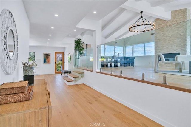 8 Clipper Rd, Rancho Palos Verdes, CA 90275 - interior space featuring baseboards, vaulted ceiling with beams, wood finished floors, and plenty of natural light
