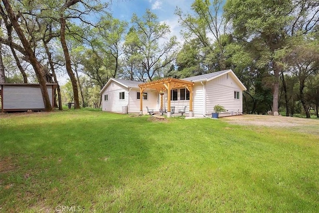 view of front of home with a front lawn and a pergola