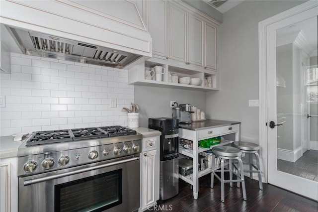 kitchen with open shelves, premium range hood, tasteful backsplash, dark wood finished floors, and high end stainless steel range oven