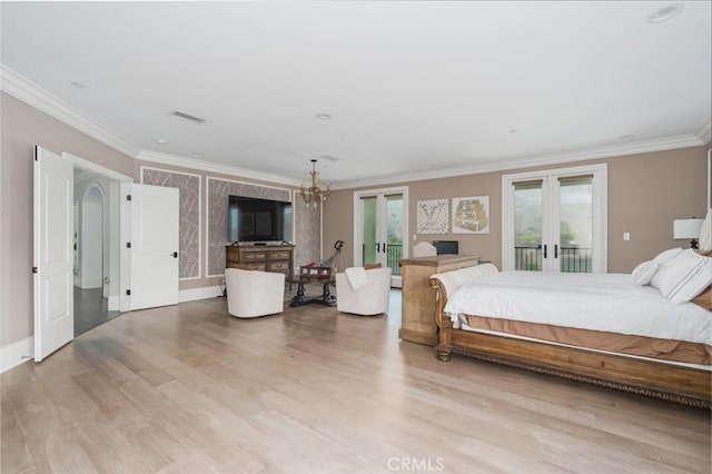 bedroom featuring french doors, light wood finished floors, crown molding, and access to outside