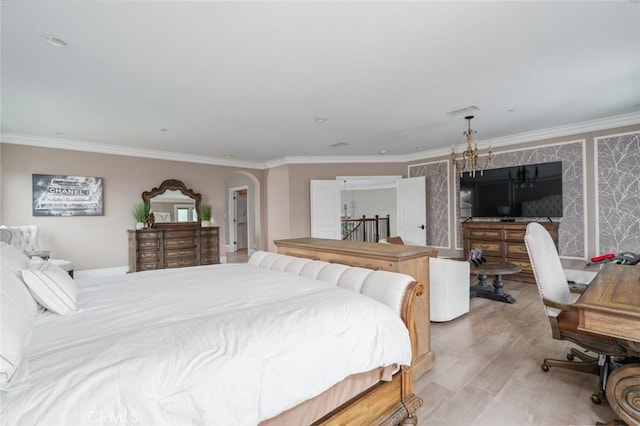 bedroom with light wood-style floors and ornamental molding