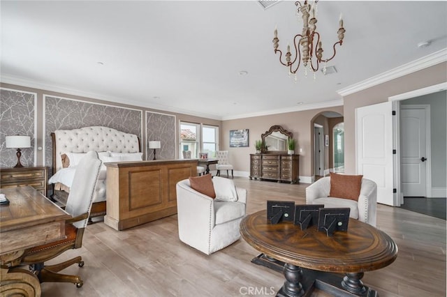 bedroom featuring an inviting chandelier, arched walkways, ornamental molding, and light wood-type flooring
