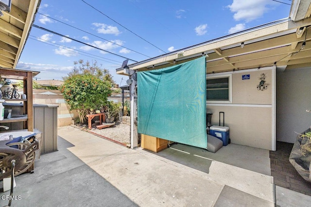 view of patio / terrace featuring fence