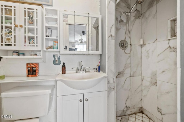full bathroom with toilet, a marble finish shower, and vanity
