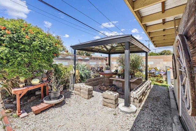 view of patio / terrace with a gazebo and fence