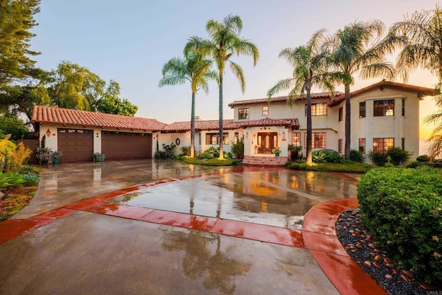 3351 Red Mountain Heights Dr, Fallbrook, CA 92028 - mediterranean / spanish-style home featuring a garage, driveway, a tile roof, and stucco siding