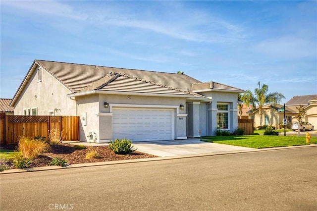 single story home featuring fence, driveway, stucco siding, and a garage
