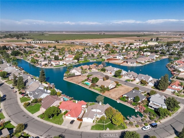 bird's eye view featuring a residential view and a water view