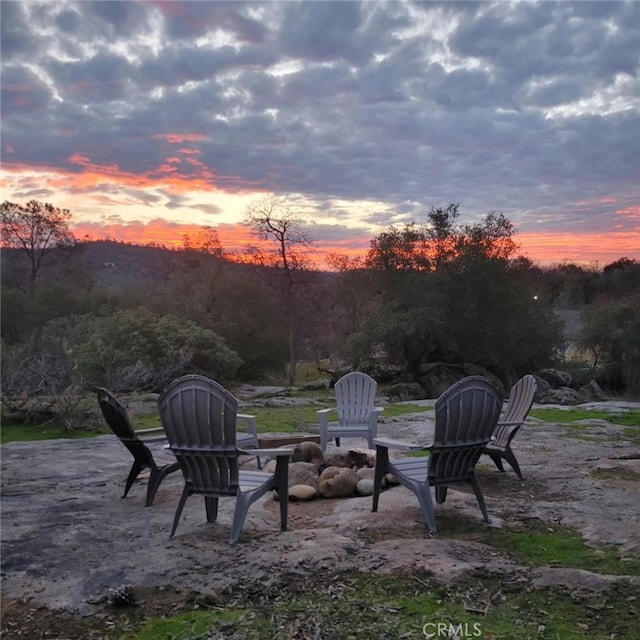 patio terrace at dusk with an outdoor fire pit